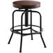 A Lancaster Table & Seating black barstool with a wooden seat and metal base.