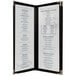 A menu board with a black frame and white paper with blue text.