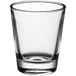 An Acopa clear shot glass on a white background.