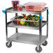 A Carlisle stainless steel utility cart with food on it.
