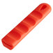 A red silicone pan handle sleeve.