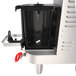 A Grindmaster PrecisionBrew automatic coffee brewer with black lids on air-heated shuttles.