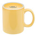 A yellow Tuxton china mug with a C-handle.