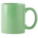A green Tuxton C-handle mug.