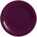 A close-up of a Fiesta® Mulberry round chop plate with a rim.