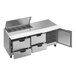 A stainless steel Beverage-Air sandwich prep table with clear lids over four drawers.