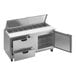 A Beverage-Air stainless steel refrigerated sandwich prep table with clear lids open.