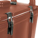 A brick red Cambro insulated soup carrier with two latches.