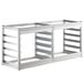 A Regency stainless steel wall mounted sheet pan rack with three shelves.