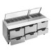 A stainless steel Beverage-Air sandwich prep table with six drawers and clear lids.