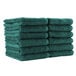 A stack of Monarch Brands hunter green hand towels.