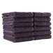 A stack of Monarch Brands eggplant-colored hand towels.