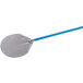 A stainless steel pizza peel with a blue handle.
