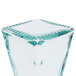 A Tablecraft Marbella glass cruet with a green and blue design on the outside.