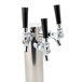 A silver Beverage-Air 3-tap tower with black handles.