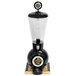 A clear glass Beer Tubes beverage dispenser with a black base.