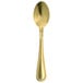 A gold Walco dessert spoon with a rectangular handle.