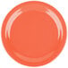 A Carlisle Dallas Ware sunset orange melamine plate on a table.