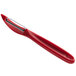 A red Victorinox vegetable peeler with a serrated high carbon stainless steel blade and a red handle.
