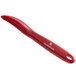 A red Victorinox peeler with a long handle.