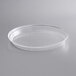 A clear plastic tray with a round surface.