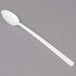 A Dart white plastic spoon with a long handle on a gray surface.