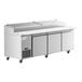 An Avantco stainless steel refrigerated pizza prep table with three doors.