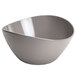 A Delfin Driftwood melamine bowl with a curved edge.