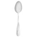 A Walco stainless steel dessert spoon with a curved handle.