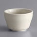 A close up of a Libbey Ultima Cream White stoneware bouillon bowl.