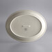 A white oval stoneware platter with a narrow rim.