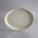 A white Libbey narrow rim oval stoneware platter on a white surface.