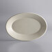 A white oval stoneware platter with rolled edges.