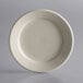 A close-up of a Libbey Princess White stoneware plate with a curved edge on a white background.