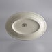 A white Libbey stoneware oval platter with a rolled edge.