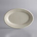 A white oval Libbey stoneware platter on a gray surface.
