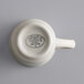 A white Libbey stoneware demitasse cup with a handle.