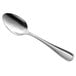 A Libbey stainless steel spoon with a silver handle.