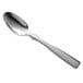 A Libbey stainless steel demitasse spoon with a silver handle on a white background.