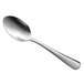 A Libbey Windsor Grandeur dessert spoon with a silver handle.