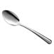 A Libbey Windsor stainless steel dessert spoon with a silver handle on a white background.