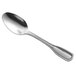 A Libbey Wellington stainless steel dessert spoon with a silver handle and spoon.