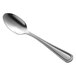 A Libbey stainless steel demitasse spoon with a silver handle on a white background.