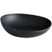 A dark gray irregular round melamine serving bowl.