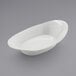 A white oval shaped GET Enterprises melamine side dish bowl.