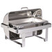 A Vollrath stainless steel Avenger roll top chafer on a counter.