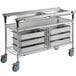 A silver Metro stainless steel food cart with trays on it.