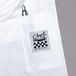 A white Chef Revival short sleeve chef jacket with a pen in the pocket.