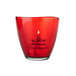 A Sterno red glass votive candle holder with a flame.