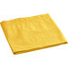 A yellow Hoffmaster tissue / poly paper table cover folded on a white background.